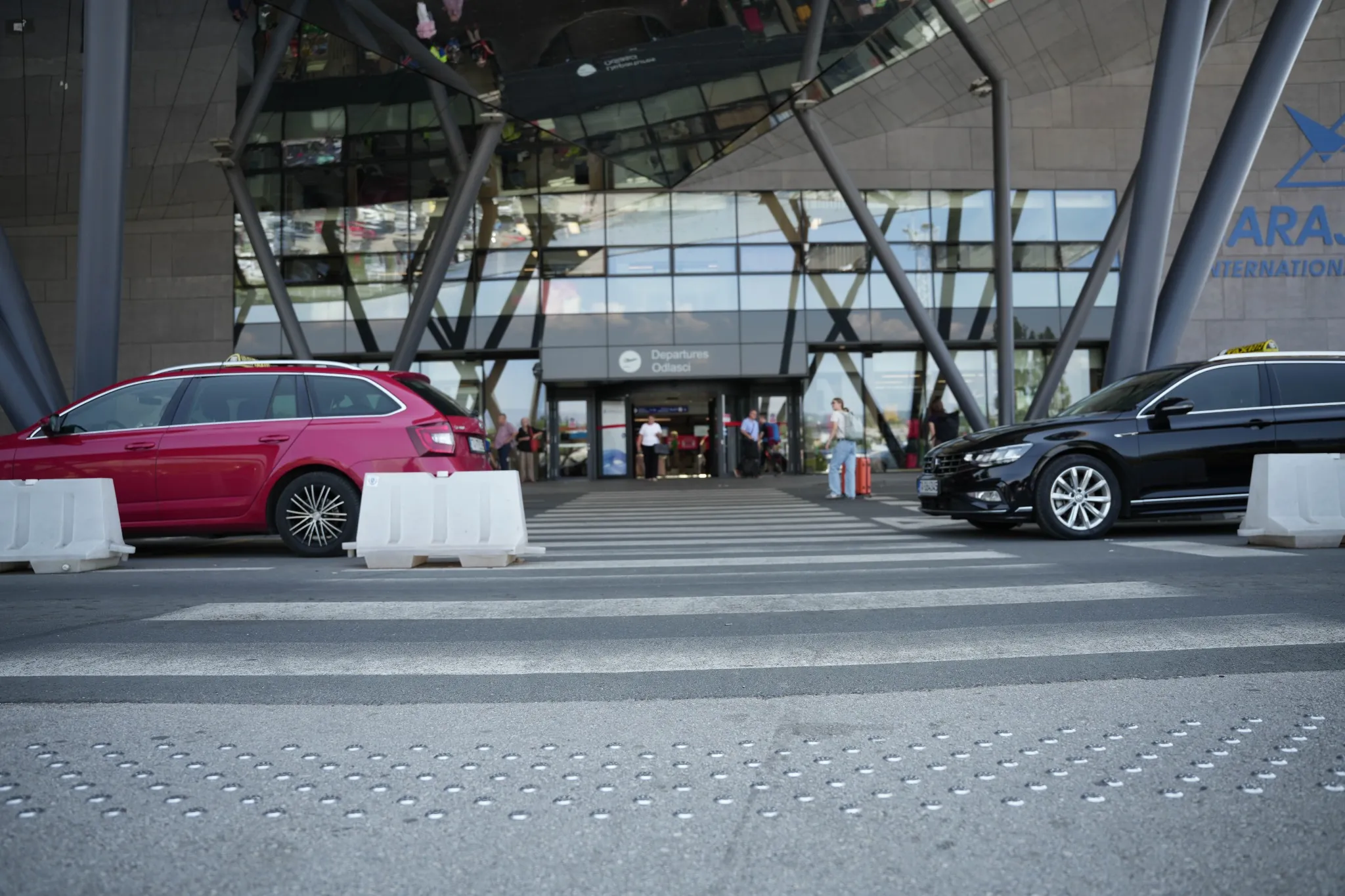 Glass doors with visual contrast strips and safety markings